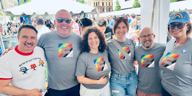 Orlando Gonzales pictured with HRC senior staff at Capital Pride 2024.