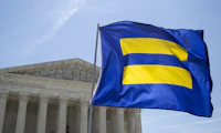 HRC flag waving in front of a building